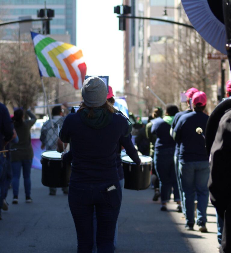Pep band marching in Downtown Raleigh