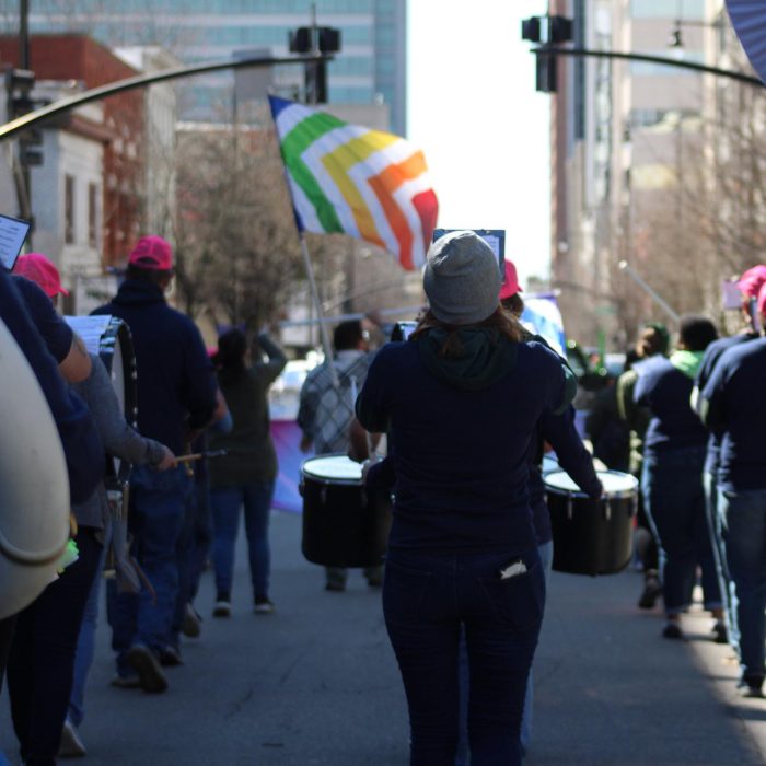 F01F103A-60DF-46D6-BB7C-EC1DE2A67A0A Pep band marching in Downtown Raleigh